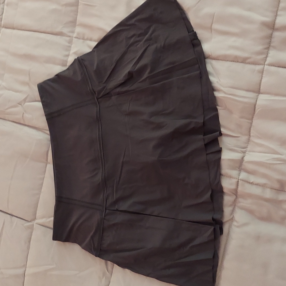 Lululemon black shirt with black built in shorts Size 6 tall.
